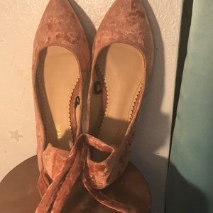 These are pink velvet shoes that lace up your leg